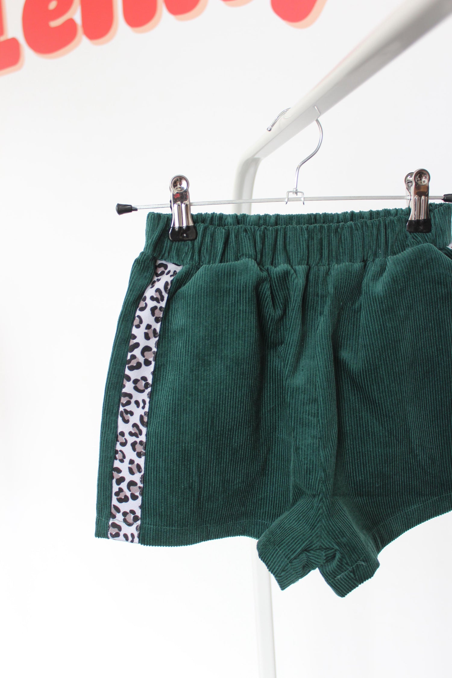 green cord shorts for kids with leopard stripe down side